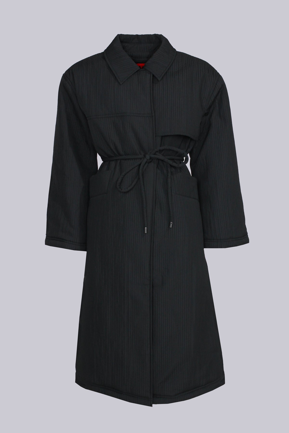 Long ribbed puffer coat with detachable shoulder pads by AEMMI