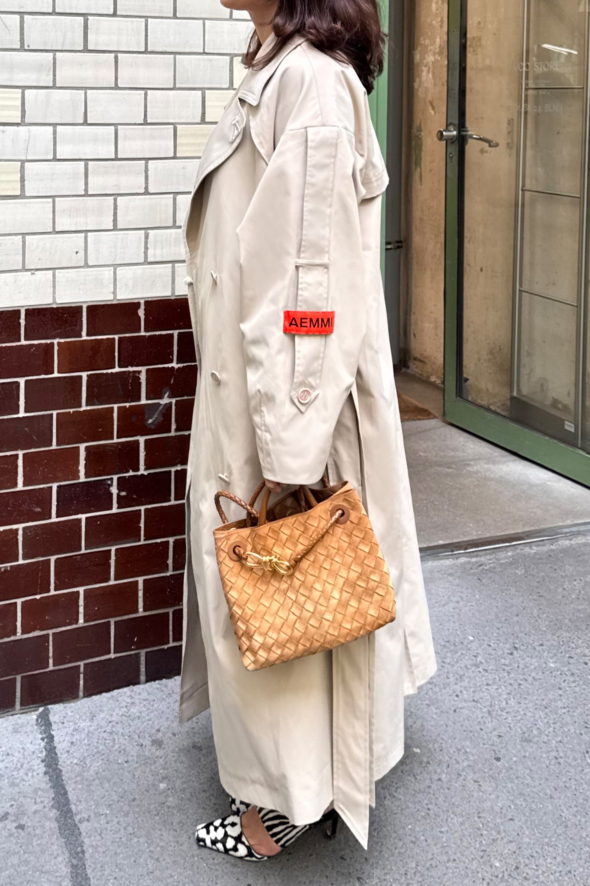 Beige oversized trench coat with waist belt by AEMMI