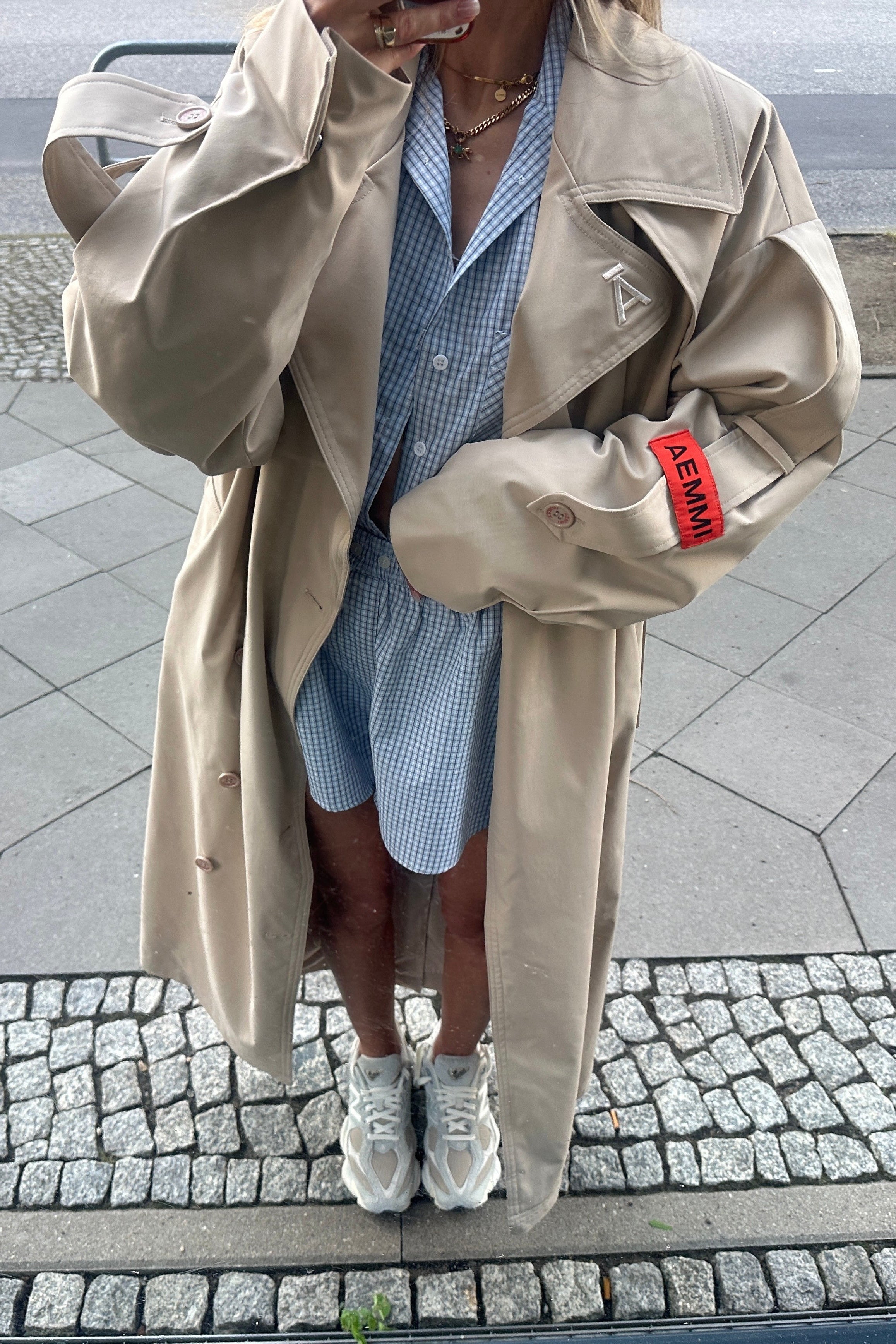 Beige oversized trench coat with waist belt by AEMMI